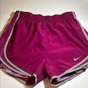 Nike Pink Athletic Shorts with Curved Hem and Elastic Waistband